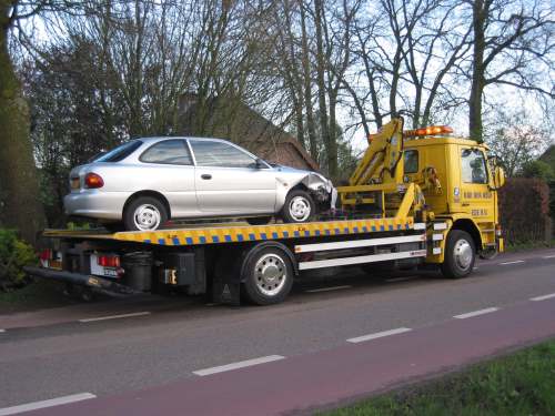 A car being towed by our towing service after getting in a car accident in Townsville.
