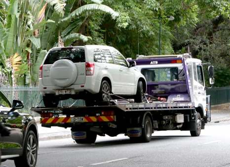 A toyota car being towed away from a no park zone in Townsville